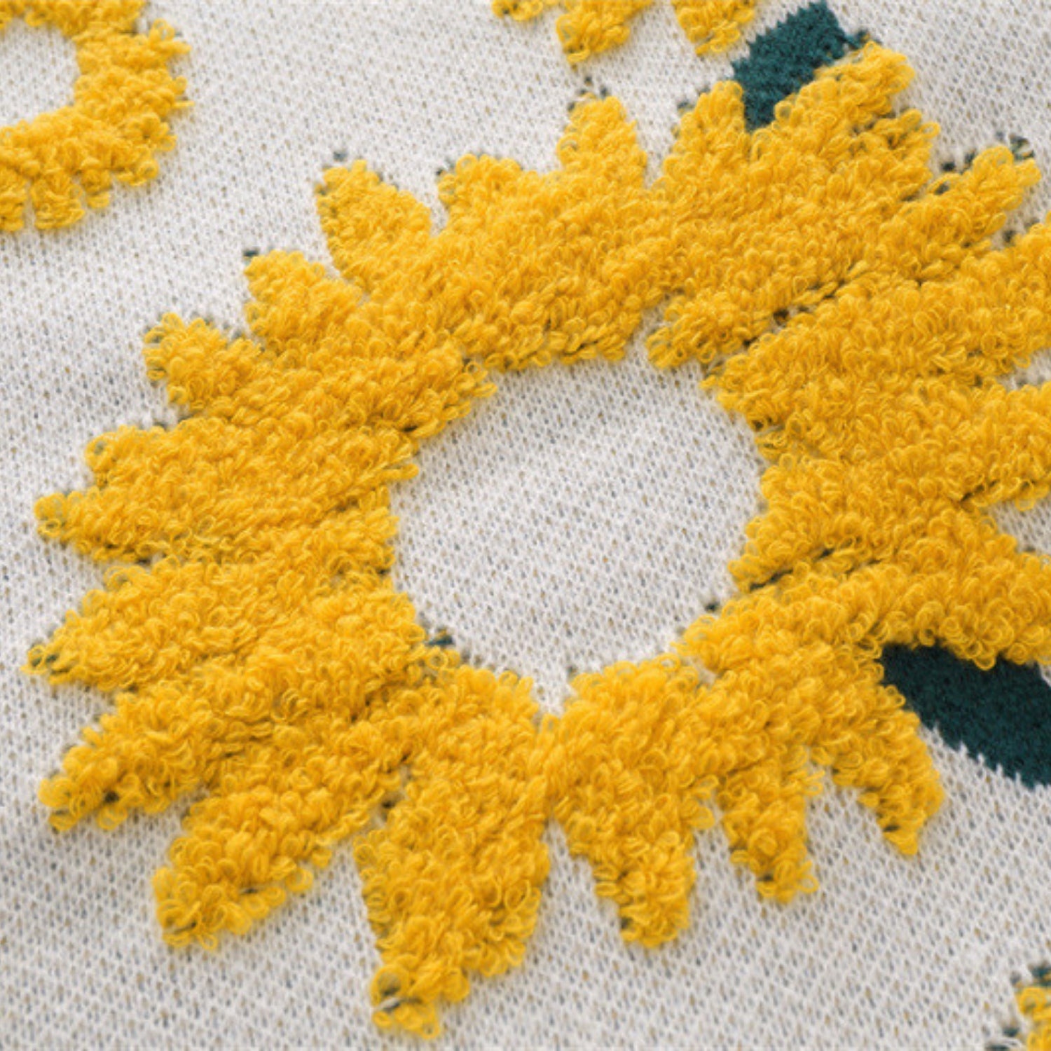 Suéter de punto con bordado de girasol