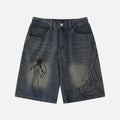 Pantaloncini in denim lavato con stampa di ragno
