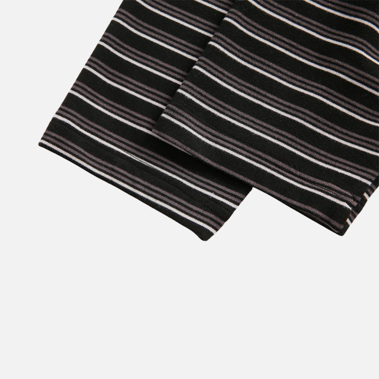 Black and white striped fabric on a light gray background