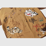 Detail view -2 of the brown unisex embroidered cat short sleeve shirt in brown