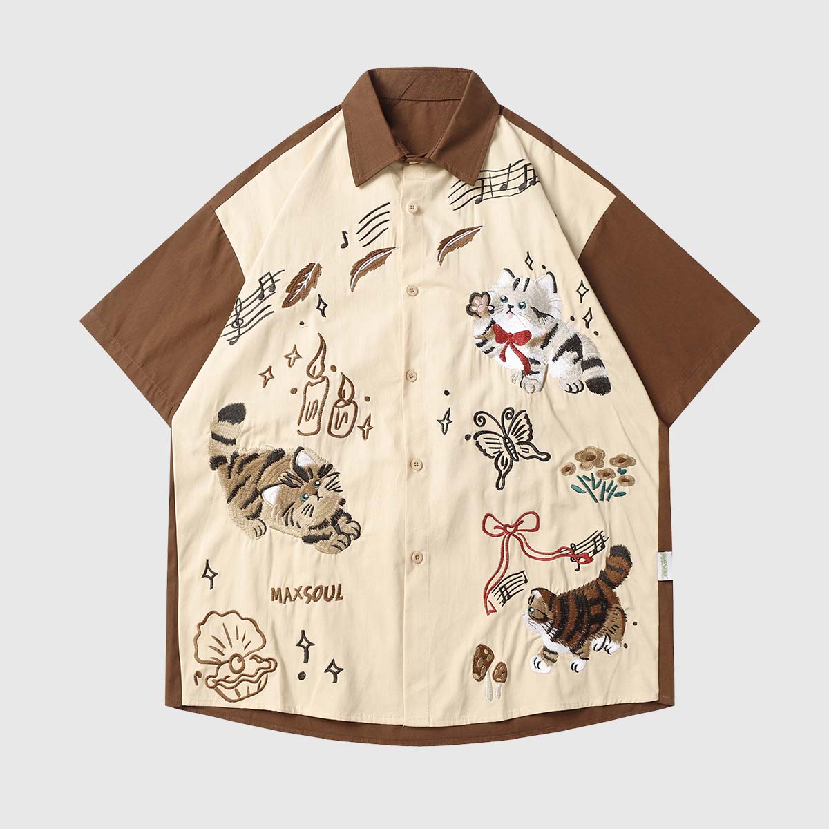 Front view of the brown unisex embroidered cat short sleeve shirt in apricot