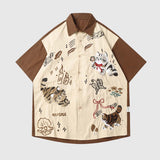 Front view of the brown unisex embroidered cat short sleeve shirt in apricot