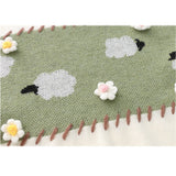 Suéter de punto con patrón de flores y ovejas