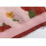 Suéter de punto de cuello alto recortado con patrón de flores